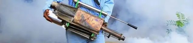 Fumigation technician using a fogger for deep pest treatment in Boulder, CO